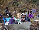 109 Lunch On Descent To Mirista Khola We continued our descending traverse towards the Miristi Khola and stopped for lunch of bread and yak cheese. From there it was steeply down, down, down, sometimes falling down, and then down some more until my knees hurt. We finally reached the Miristi Khola (3600m) at 14:30. What seemed such a peaceful stream from up high turned out to be a torrent. Our campsite and the route to Annapurna North Base Camp, alas, were on the other side.